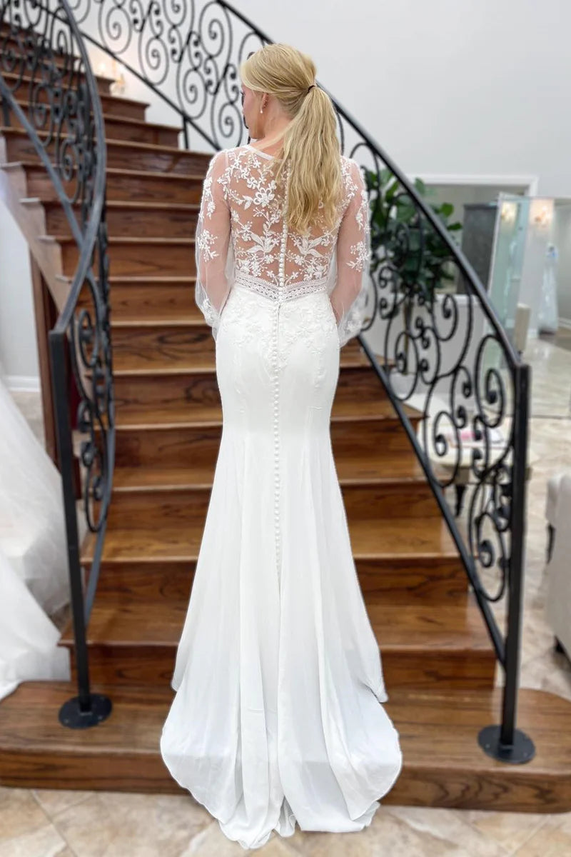 Back view of mermaid wedding gown with appliques.