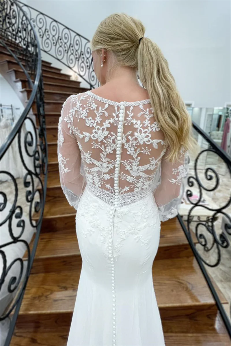 Long mermaid bridal gown with elegant V-neckline.