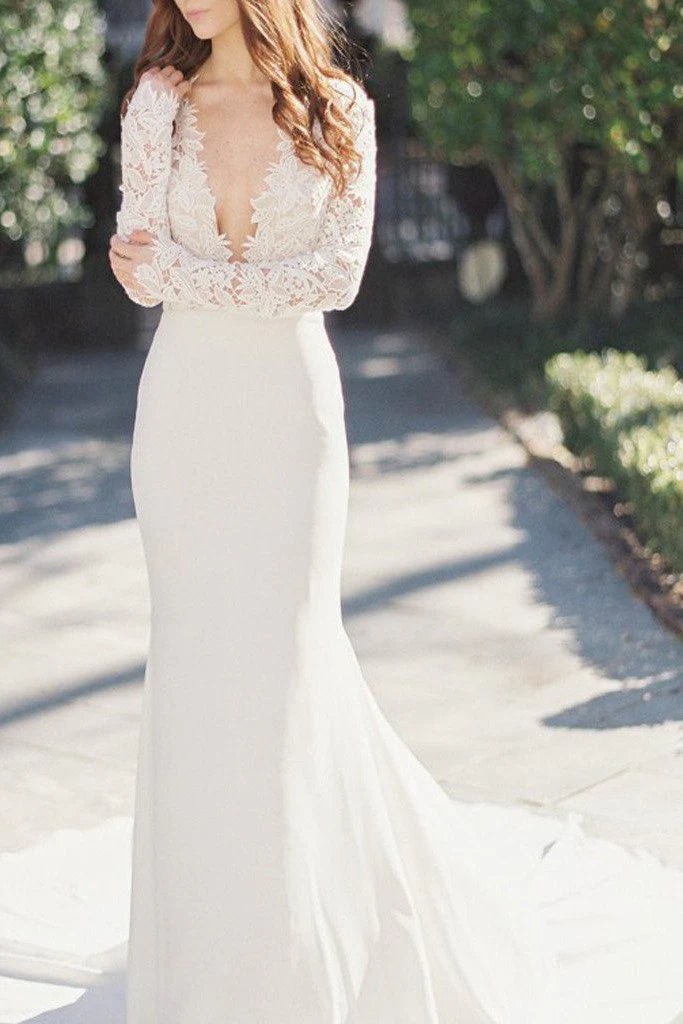 Elegant mermaid wedding dress with deep V-neck, long lace sleeves, and intricate lace detailing.