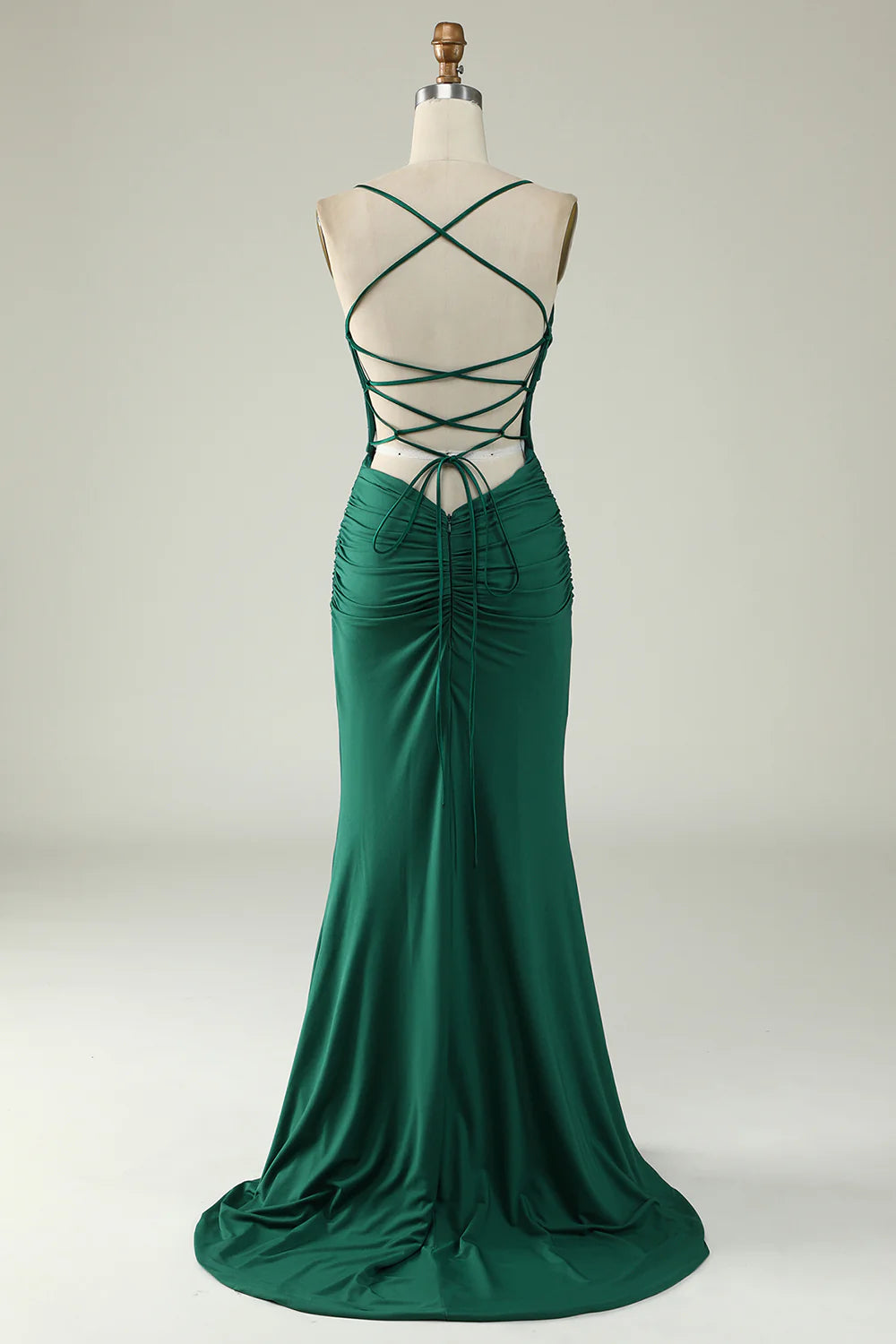 Side view of dark green mermaid deep V-neck long prom dress.