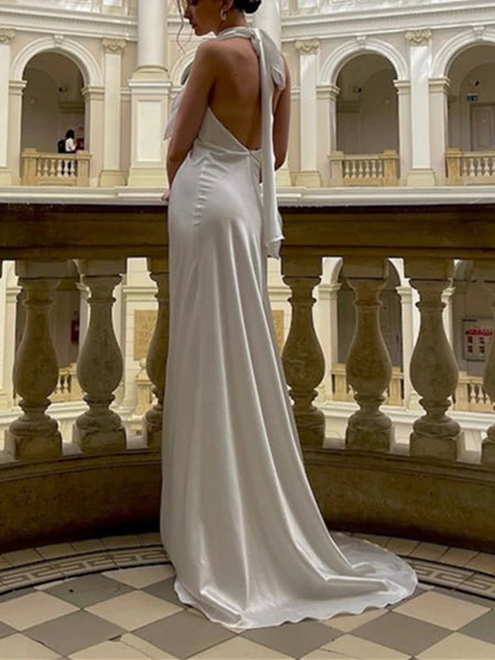 Back view of a mermaid floor-length sleeveless wedding dress.