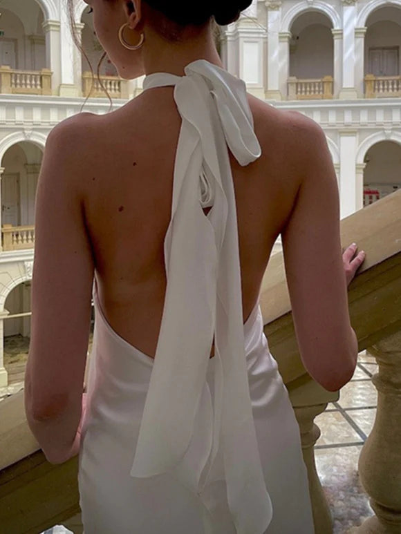Close-up of the bodice and mermaid skirt of a wedding dress.