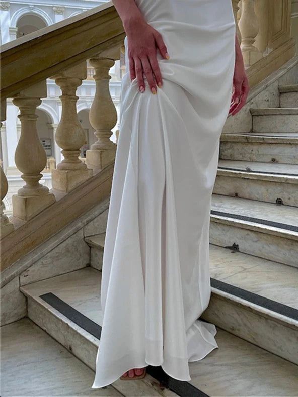 Bride posing in a sleeveless mermaid wedding dress.