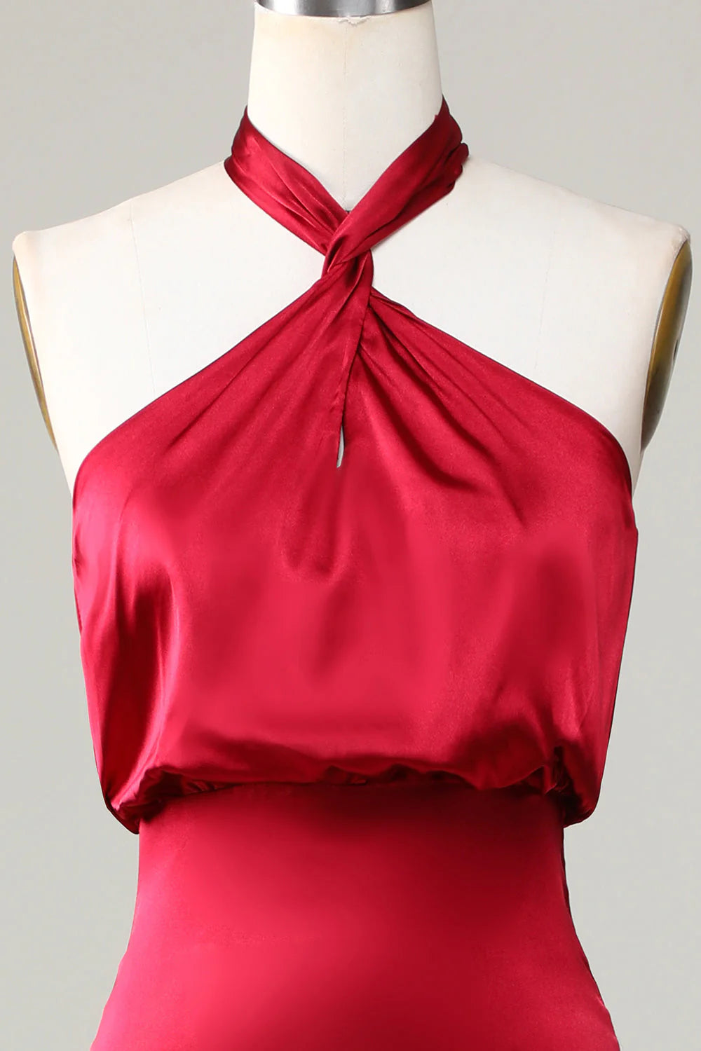 Side profile of the ankle-length mermaid halter gown.