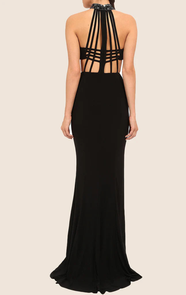 Back view of a woman in a mermaid halter formal gown.