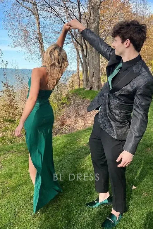 Woman in a green mermaid halter evening gown.