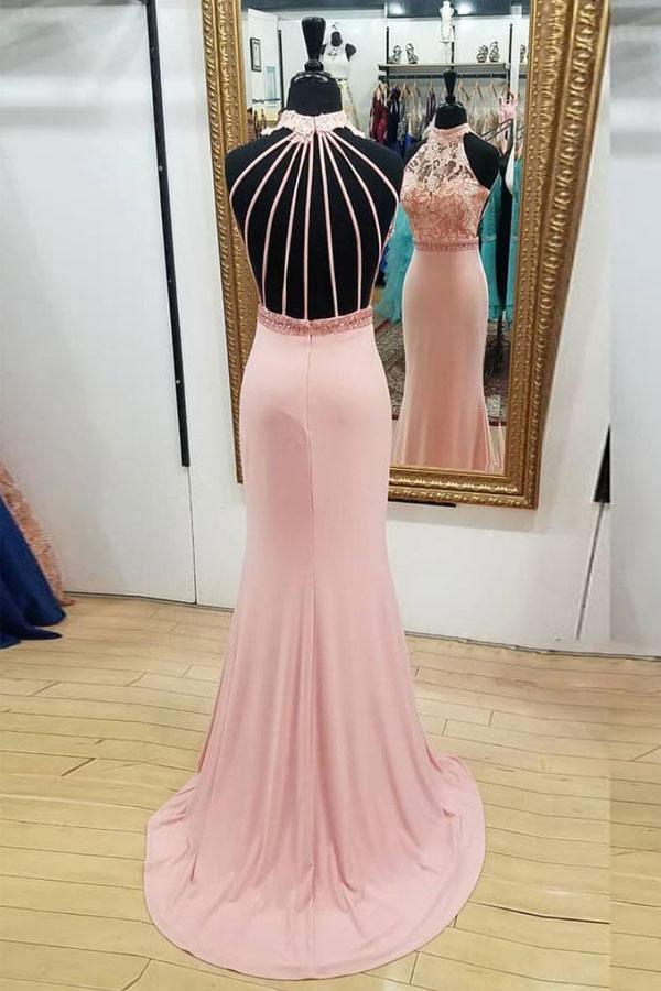 Back view of a mermaid lace prom dress showing open back design.