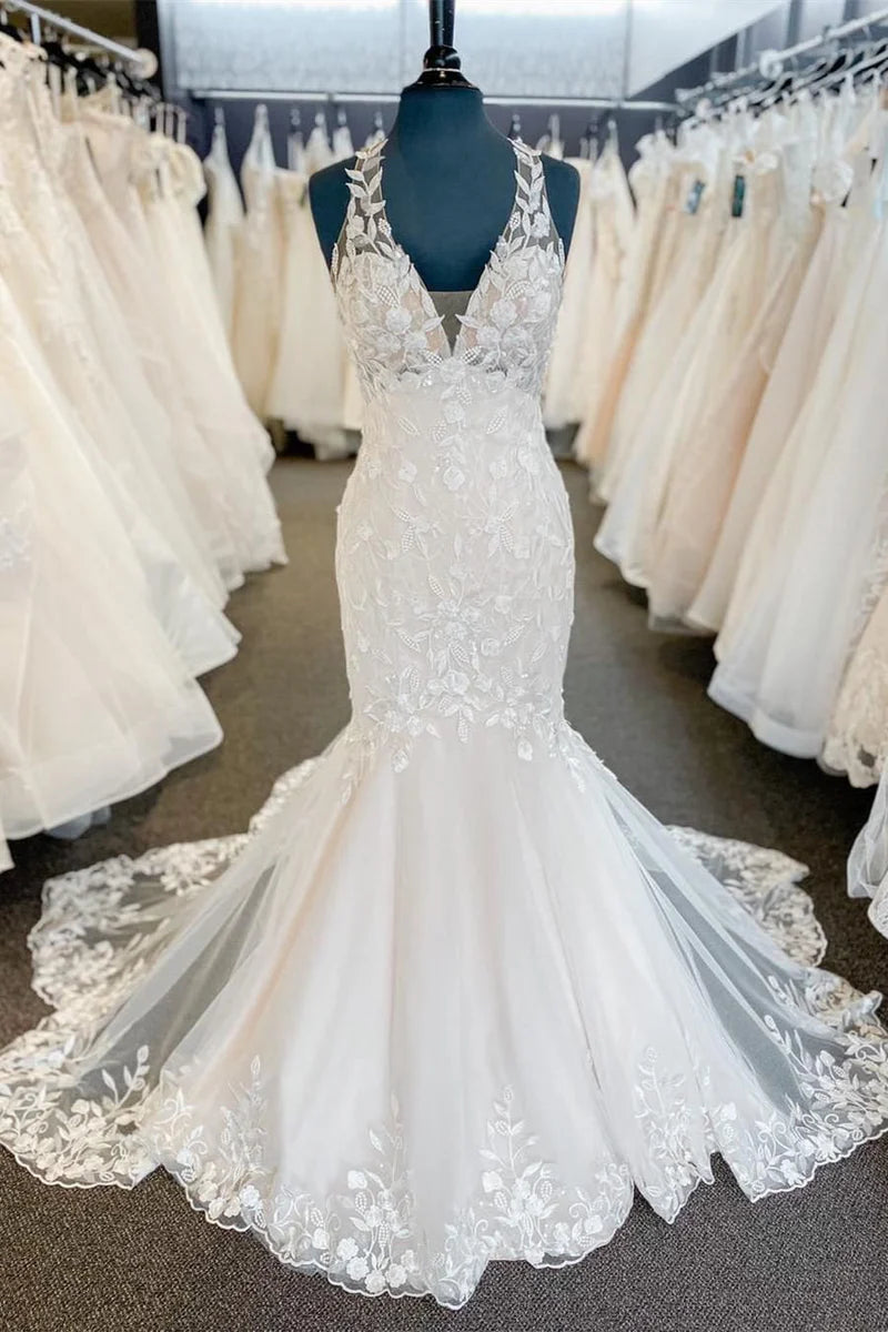 Elegant mermaid halter lace wedding dress with a long train.
