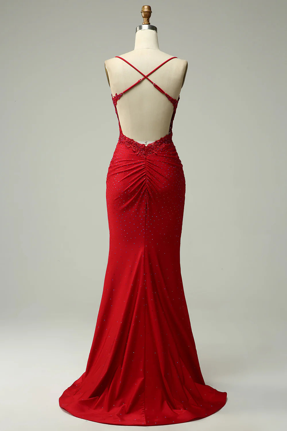 Close-up of the halter neckline and intricate beading on the mermaid prom dress.
