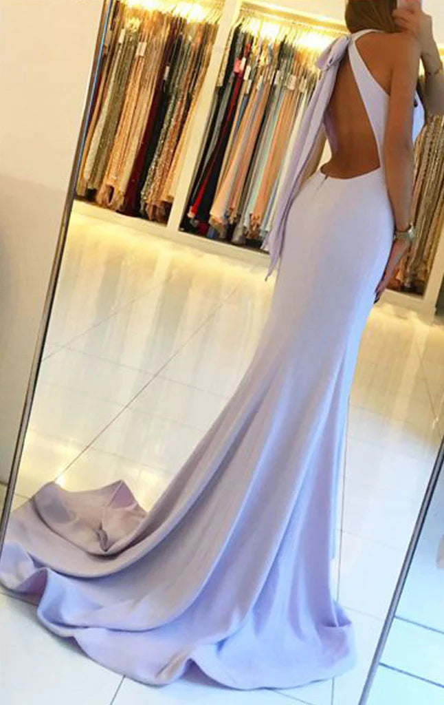 Front view of a woman wearing an elegant mermaid halter prom dress.