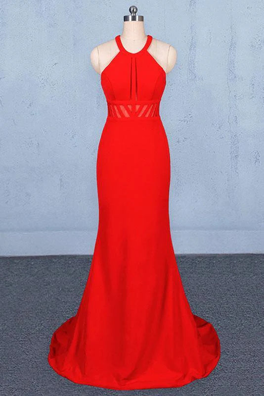 Woman wearing an elegant mermaid halter open back long prom dress.