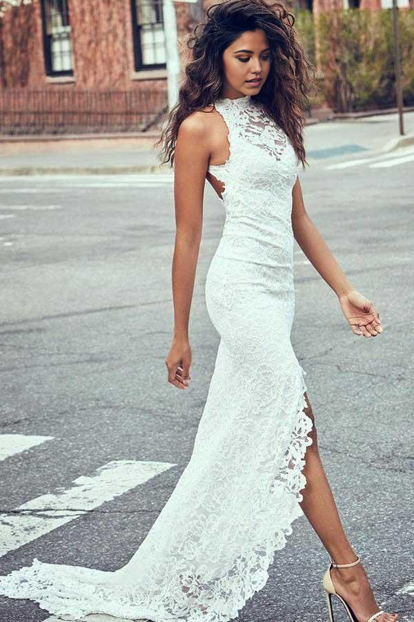 Elegant mermaid wedding dress with high neckline, intricate lace, and a flowing court train.