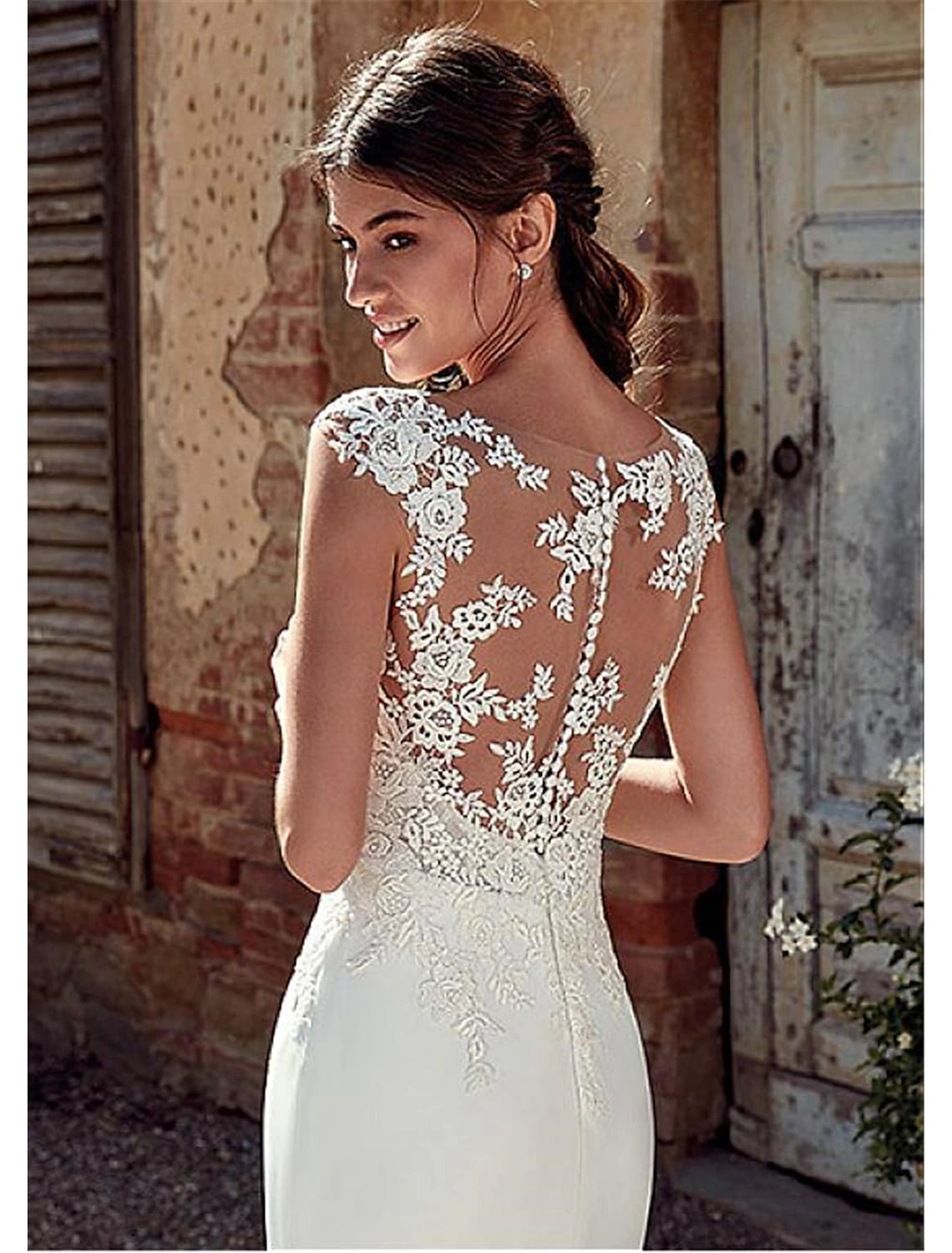 Full view of a bride wearing a mermaid chiffon wedding dress suitable for outdoor ceremonies.
