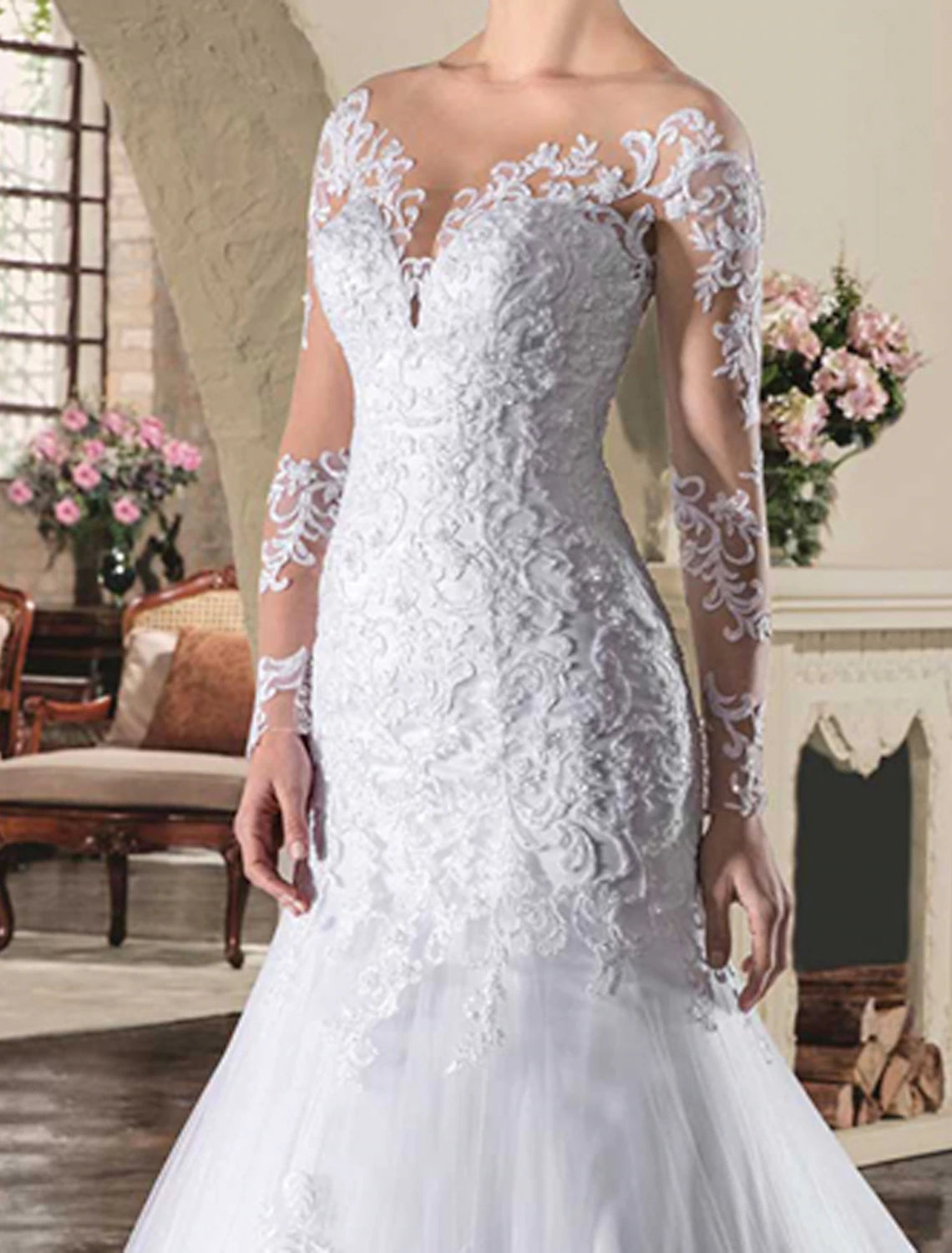 Side view of a model in the mermaid long sleeve wedding dress, showcasing the silhouette and court train.