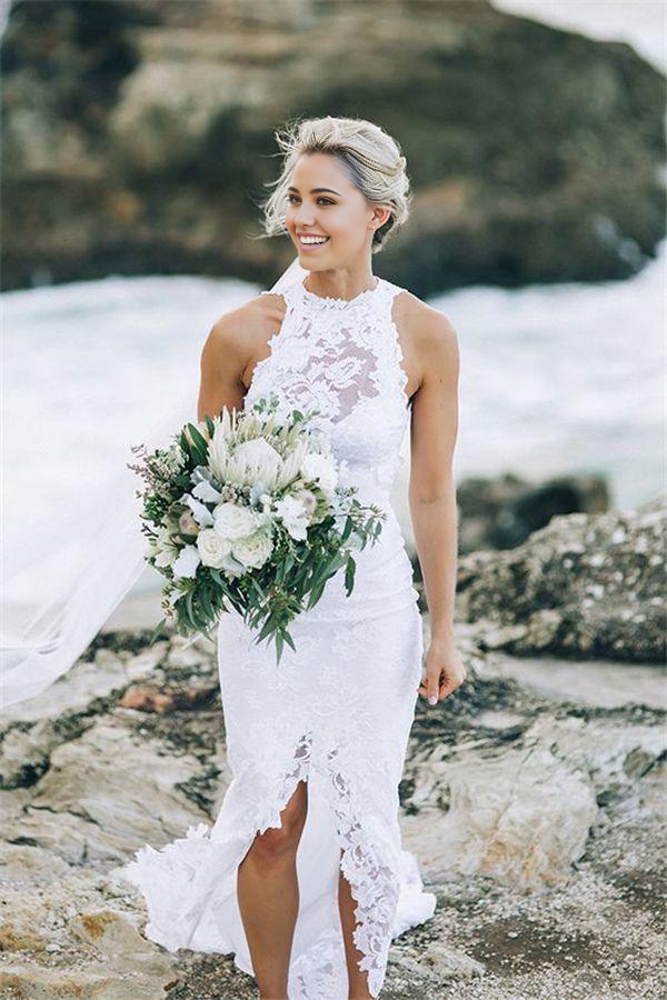 Elegant mermaid wedding dress with illusion neckline and sweep train.