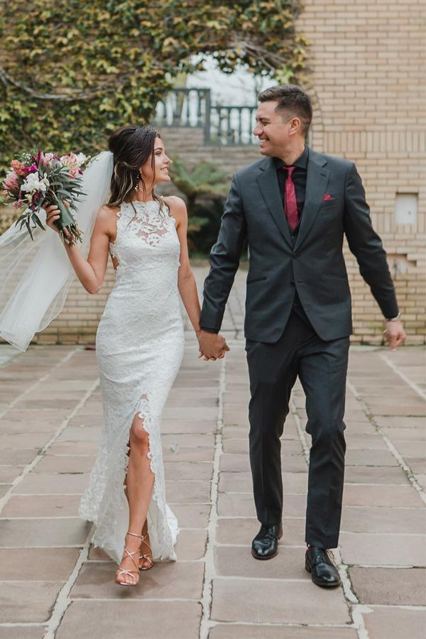Full view of the mermaid wedding dress with a long sweep train.