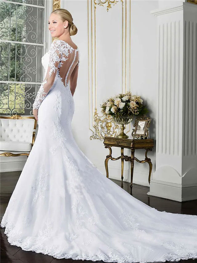 Back view of a mermaid wedding dress showing court train and lace details.