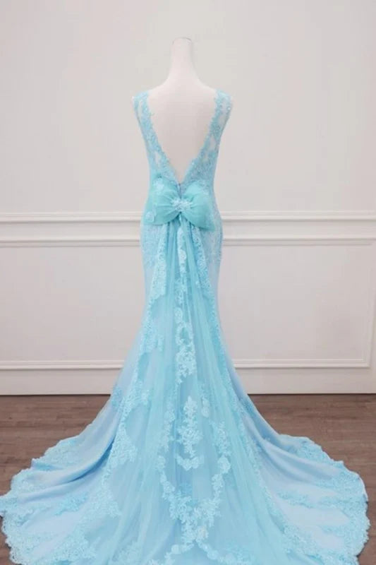 Side view of a mermaid formal gown featuring intricate lace details.