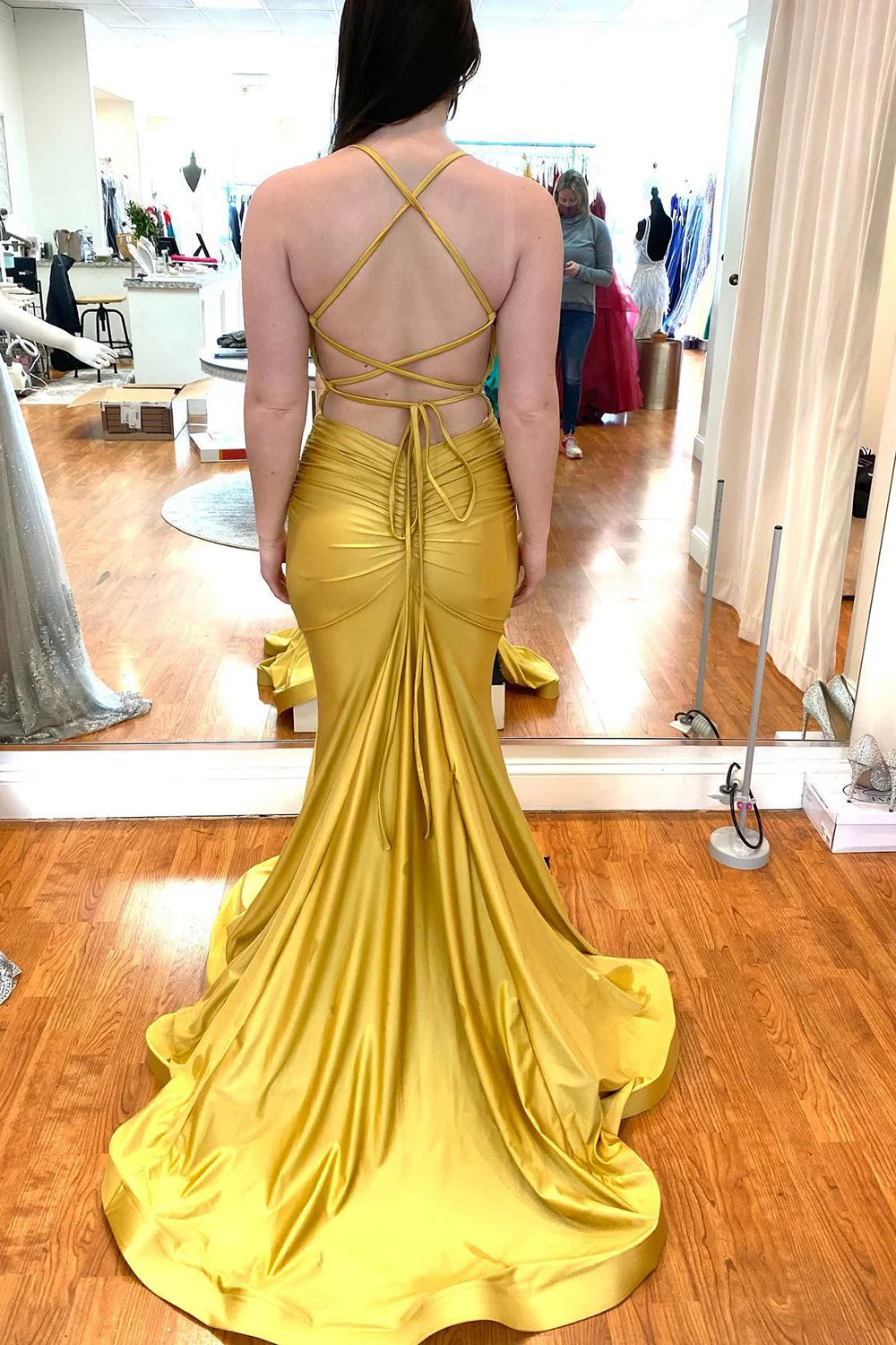 Side view of a long mermaid formal gown.