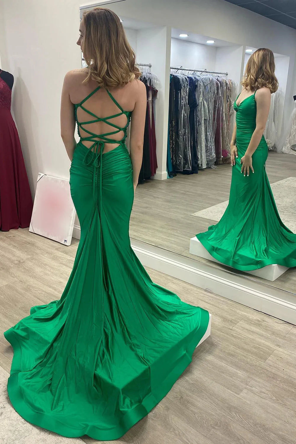 Close-up of the intricate lace-up back on a mermaid prom dress.