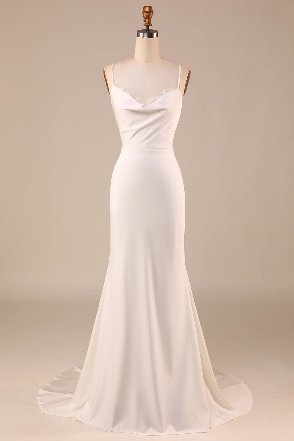 Ivory mermaid wedding dress with lace-up back, front view.