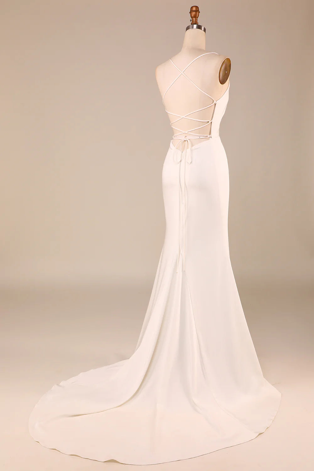 Back view of ivory mermaid wedding dress showing lace-up detail.
