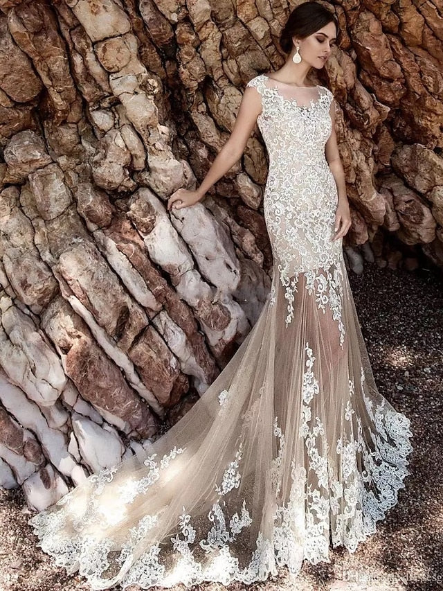 Back view of the mermaid wedding dress, showing the court train and lace detailing on the skirt.