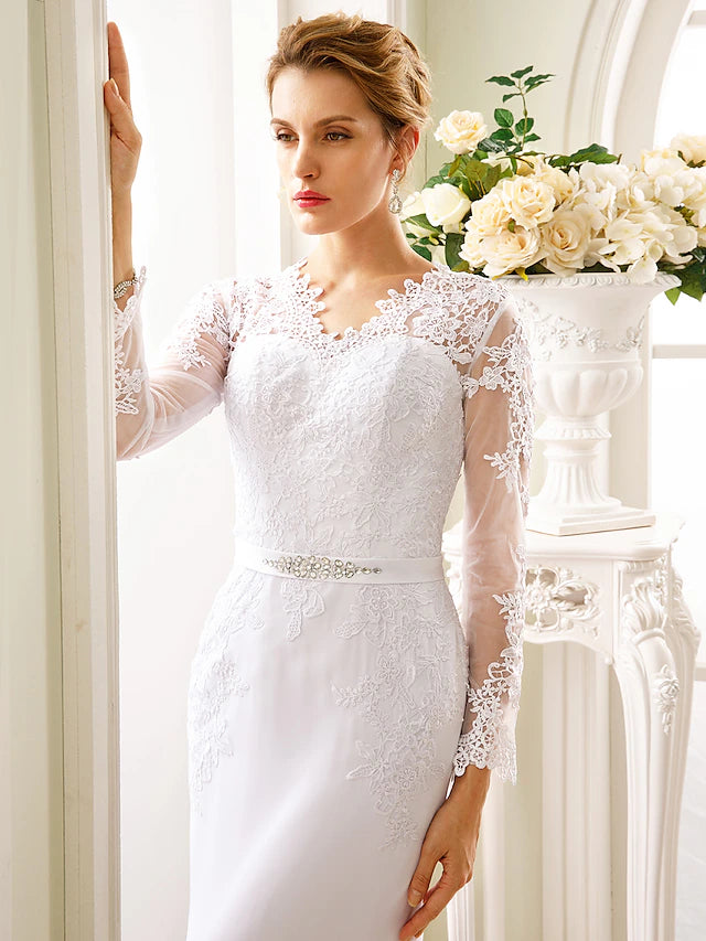 Detail of the sash and ribbon appliques on a formal dress.