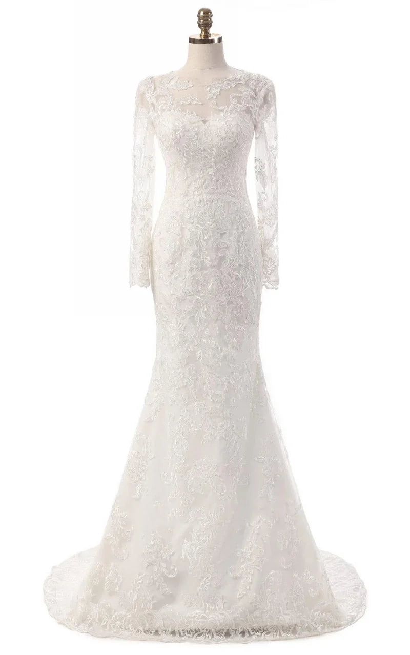 Woman wearing an elegant ivory mermaid long sleeve lace gown with illusion V-neck.