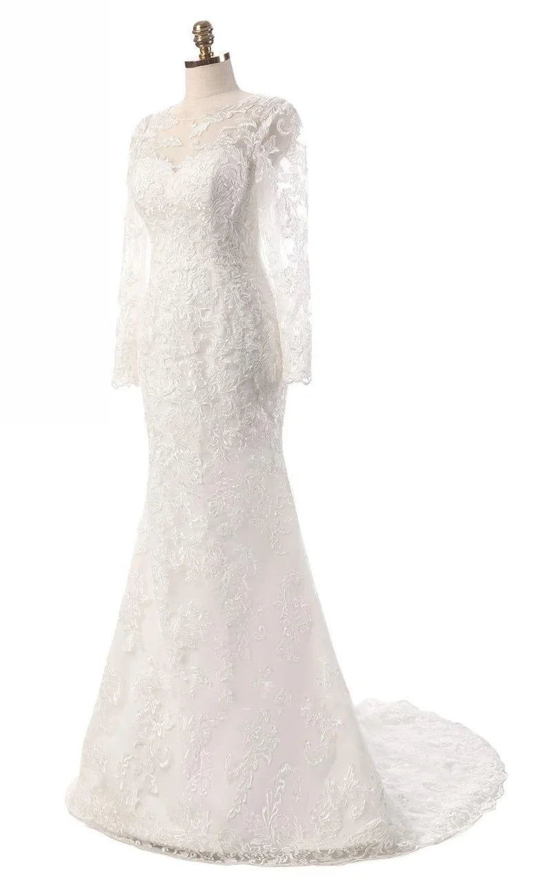 Side view of a woman in an ivory mermaid long sleeve dress, highlighting the silhouette.