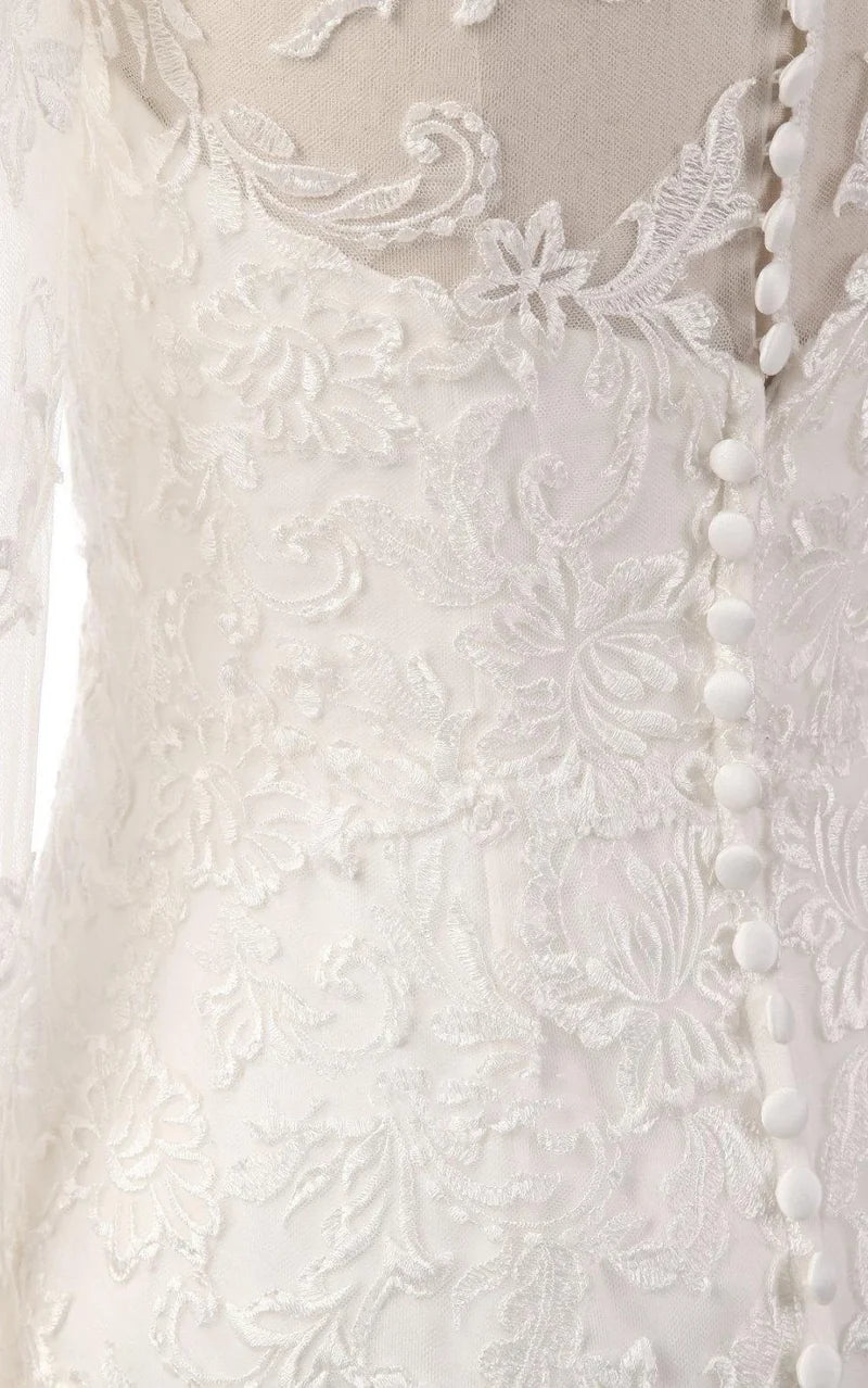 Close-up of the lace and illusion details on the bodice and sleeves of the mermaid gown.