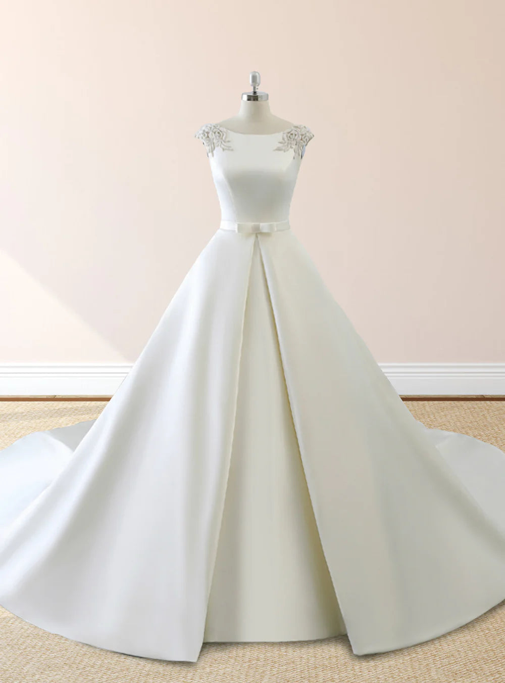 Elegant bride in a white long-sleeve mermaid wedding dress with lace-up back and subtle pearl embellishments.