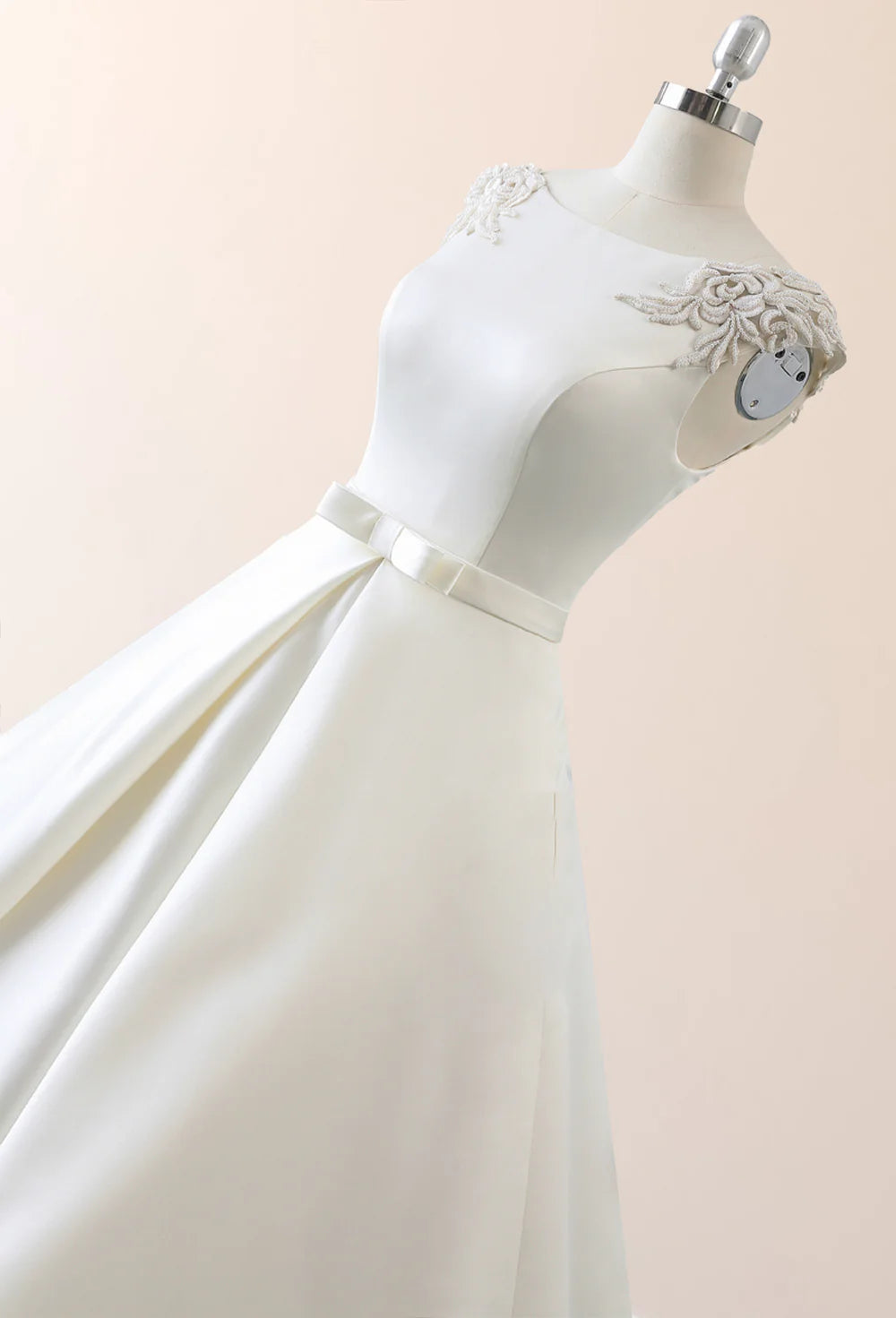 Back view of a white long-sleeve mermaid wedding dress, showcasing the intricate lace-up closure.
