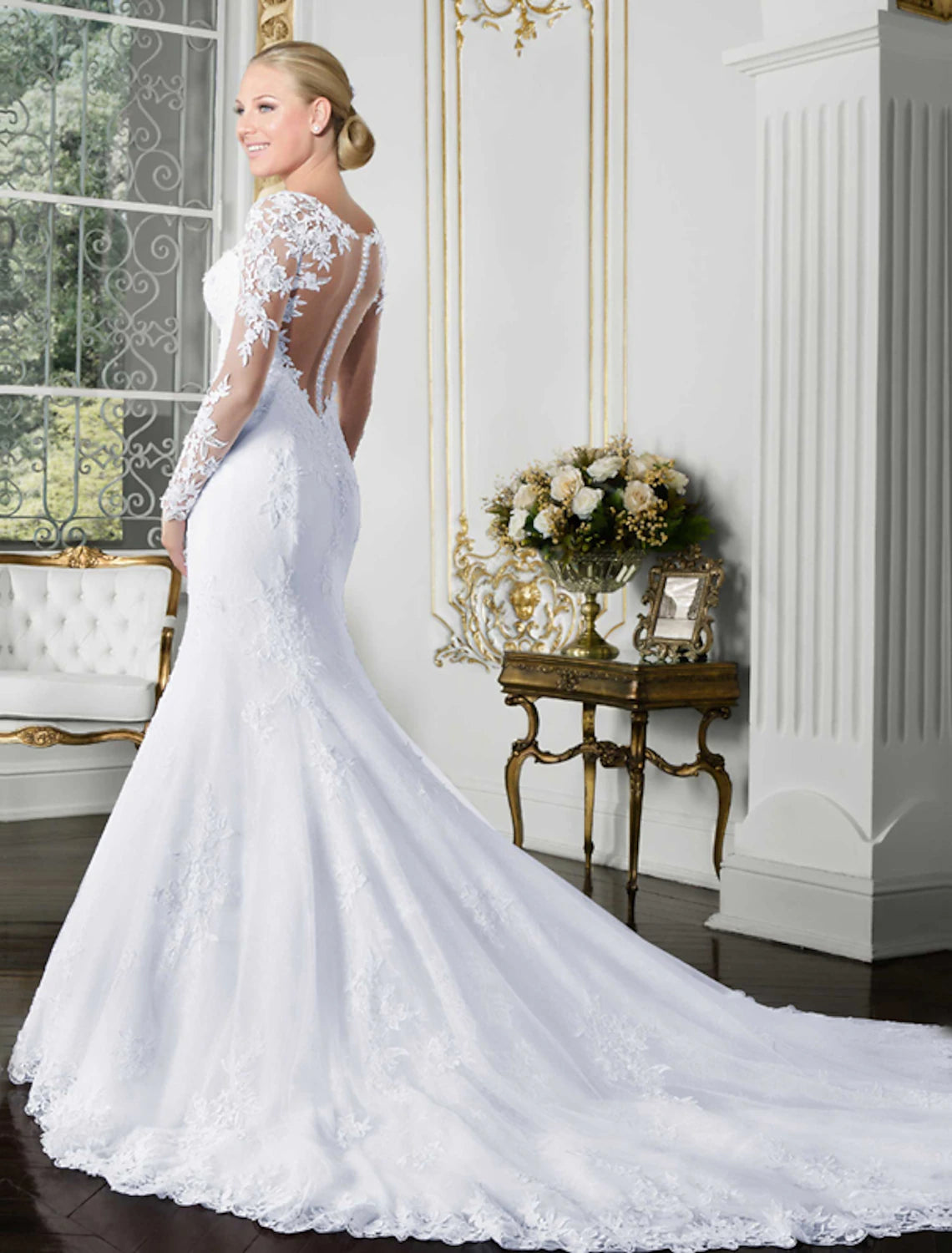 Back view of mermaid wedding dress showing open back design.