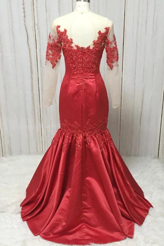 Back view of a long satin mermaid gown with intricate lace.