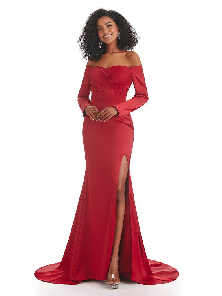 Model wearing an elegant long sleeve mermaid satin bridesmaid dress with a side slit.
