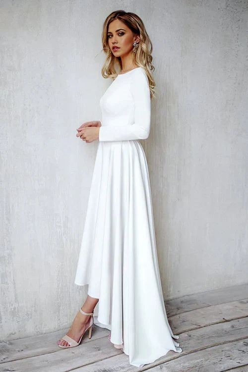 Back view of a satin mermaid wedding dress with open back.