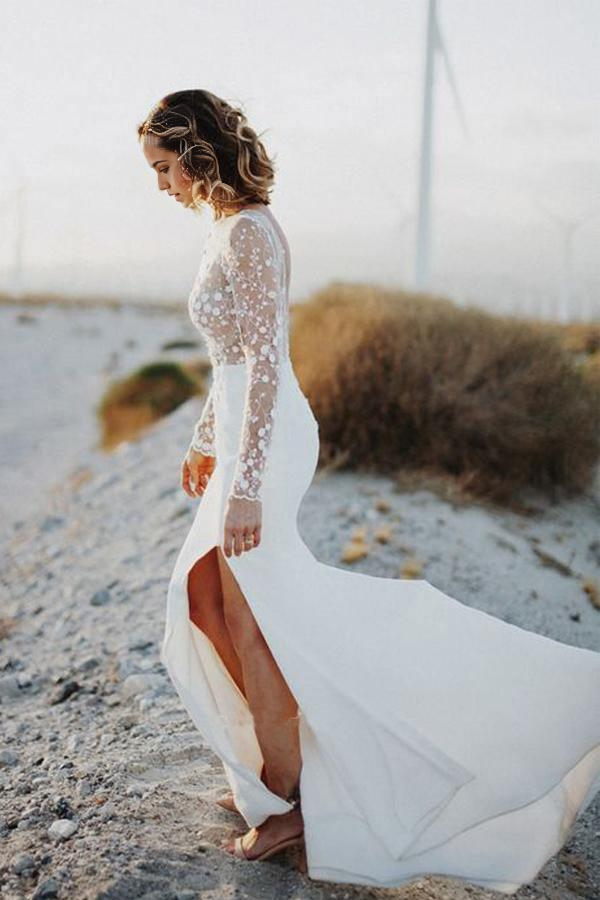 Elegant mermaid wedding dress with long lace sleeves and scoop neck.
