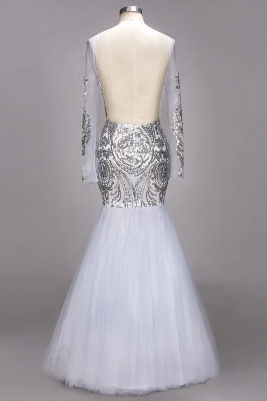 Back view of a model in a floor-length sequined mermaid gown.