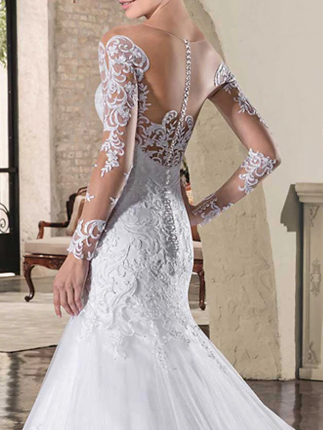 Back view of the mermaid wedding dress showcasing the open back design.