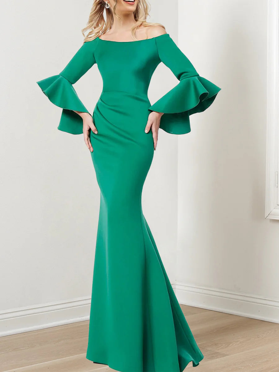 Elegant mermaid off-shoulder mother of the bride dress with 3/4 sleeves in a formal setting.