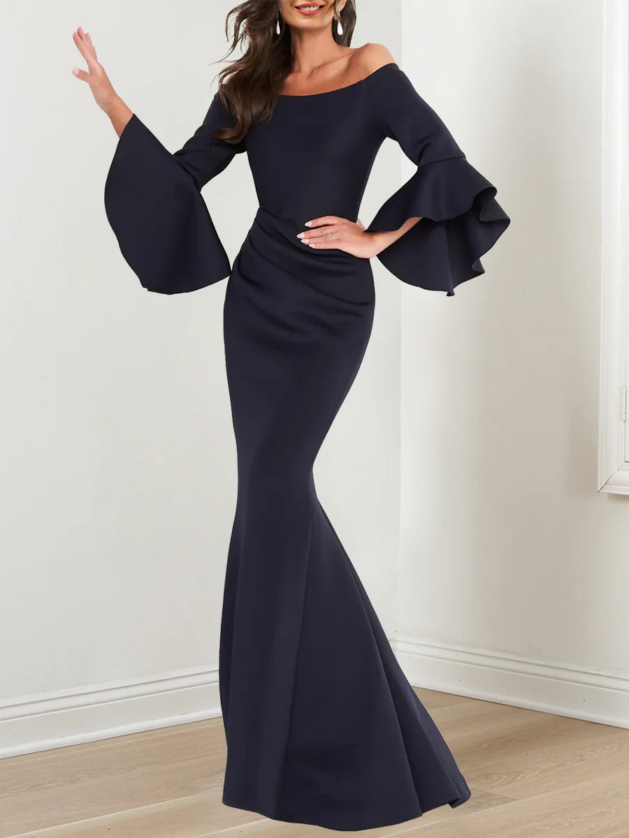 Side profile of the sophisticated 3/4 sleeve mermaid dress.