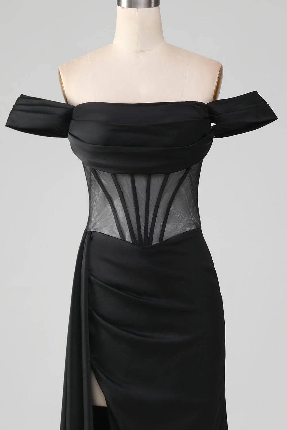 Close-up of off-shoulder satin corset on black mermaid dress.