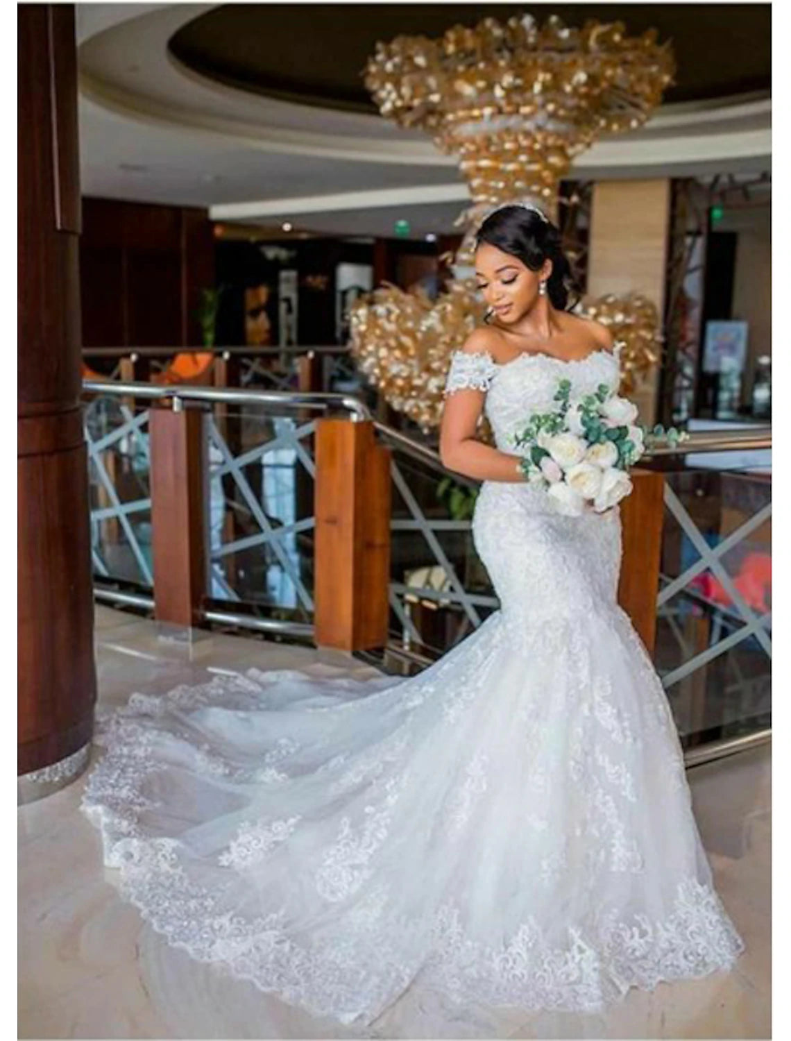Back view of a mermaid wedding gown featuring a chapel train.