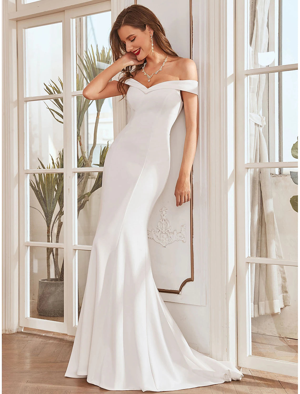 Close-up of the stretch fabric and pleats on a wedding dress.