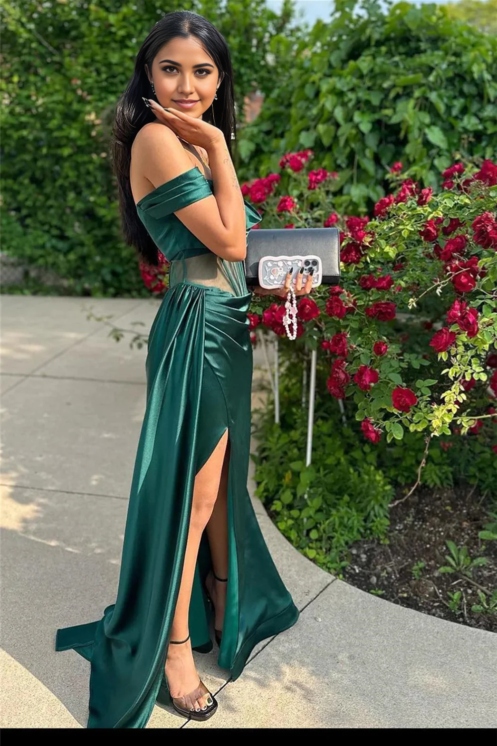 Back view of the dark green off-shoulder corset prom dress.