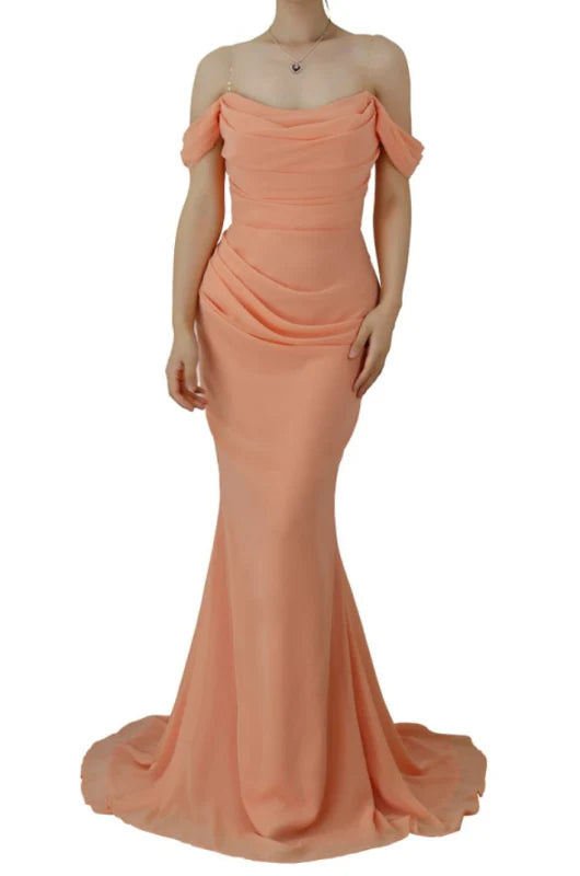 Woman wearing an elegant off-shoulder mermaid prom dress.