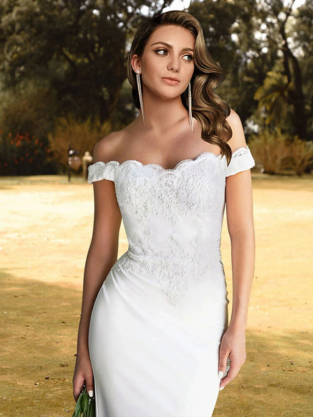 Back view of a mermaid trumpet wedding dress featuring lace details.