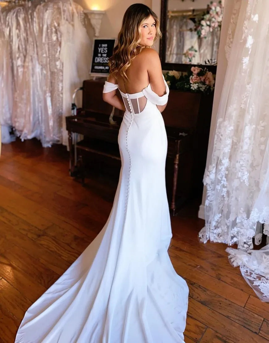 Mermaid off-shoulder satin wedding dress, side view.
