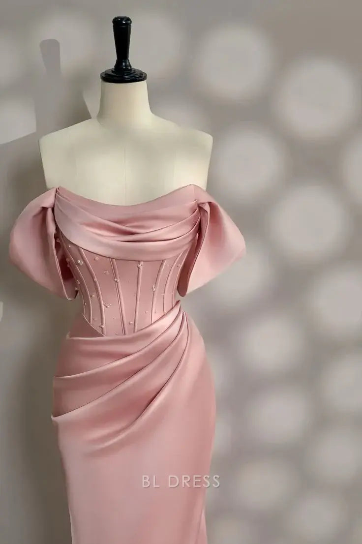 Pink mermaid formal dress featuring off-shoulder neckline and delicate pearls.